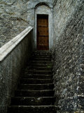 Narrow Stairway to a Wooden Door Inside the Grounds at Brolio Castle, Tuscany, Italy