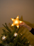 Buy Placing a Star on a Christmas Tree at AllPosters.com