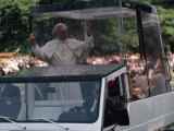 Buy Pope John Paul II Rides in his Bulletproof Vehicle Through Warsaw, Poland at AllPosters.com