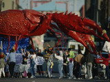 Louisianans Revel Beneath a Giant Crayfish Mardi Gras Float, New Orleans