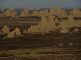Buy Nomads Pass by Travertine Towers on the Bed of a Shrinking Lake at AllPosters.com