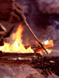 Buy Traditional Barabaig Blacksmith Pours Brass into a Bracelet Mould at AllPosters.com