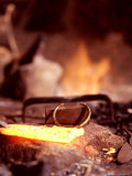 Buy Traditional Barabaig Blacksmith Makes a Brass Bracelet at AllPosters.com