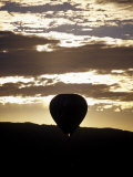 Buy The Silhouette of a Hot Air Balloon and Jet Flame at Dawn, Australia at AllPosters.com