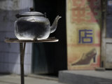 Buy Teapot Warms on a Solar Stove in a Street, Qinghai, China at AllPosters.com