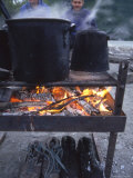 Buy Two Men at Camp Are Drying their Shoes under Camp Cook Fire at AllPosters.com