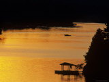 Scenic View of Boat on a Lake a Sunset