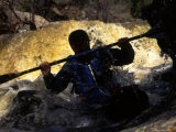 Buy Silhouette of Man Kayaking Through Flooded Canyon at AllPosters.com