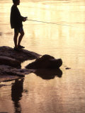 Buy Silhouette of Man Fishing from the Edge of the River, Colorado at AllPosters.com
