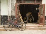 Buy Two Bicycles Parked in Front of Woodworker's Shop, Jingzhou, China at AllPosters.com