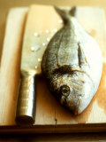 Buy Gilthead Bream on a Wooden Board with Cleaver at AllPosters.com