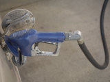 Woman Fills Up Her Car with Gasoline