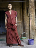 Buy Young Buddhist Monk Outside a Doorway, Qinghai, China at AllPosters.com