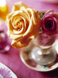 Yellow and Red Rose in a Glass as Table Decoration