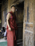 Buy Young Buddhist Monk at a Doorway, Qinghai, China at AllPosters.com