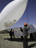 Buy Workers Prepare to Launch an Industrial Dirigible, Qinghai, China at AllPosters.com