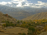 Buy Village with a Buddhist Monastery in Mustang, Himalayas Behind at AllPosters.com
