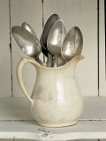 Old Silver Spoon in Light Coloured Ceramic Jug