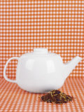 White Teapot and Tea Mixture
