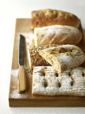 Buy Assorted Loaves on Wooden Chopping Board at AllPosters.com