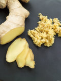 Fresh Ginger Root in Slices and Grated