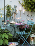 Table with Candles and Roses on a Terrace
