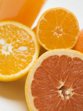 Glass of Orange Juice, Grapefruit and Oranges