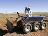 Buy Astronaut Driving Electric Tractor Prototype at AllPosters.com