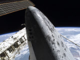 Buy Space Shuttle Discovery Docked to the International Space Station at AllPosters.com