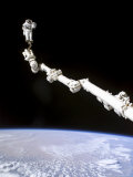 Buy Astronaut Anchored to a Foot Restraint at AllPosters.com