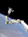 Buy Astronaut Anchored to a Foot Restraint at AllPosters.com