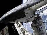 Buy Space Shuttle Discovery Docked to the International Space Station at AllPosters.com