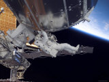 Buy Astronaut Participating in Extravehicular Activity at AllPosters.com