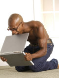 Buy African-American Man Biting Laptop on the Floor at AllPosters.com