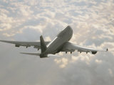 Buy Airplane Flying Above Clouds at AllPosters.com