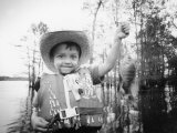 Buy Boy with Fish at AllPosters.com