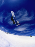Snowboarder Doing a Trick in Midair