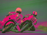 Two People Racing Motorcycles