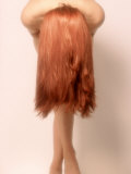 Nude Woman with Long Red Hair in Graceful Pose