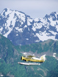 Buy Seaplane in Flight Near Mountains, AK at AllPosters.com