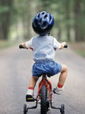 Little Boy Riding His Bicycle with Helmet