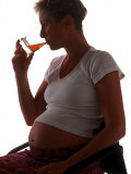 Silhouette of Pregnant Woman Drinking Alcohol