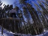 Man Riding Log on Snowboard, Vail, CO