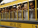 School Children Looking Out School Bus Windows