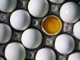 Cracked Egg in the Middle of Other Eggs