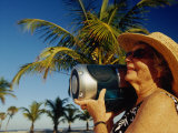 Mature Woman Listens to Radio on Florida Beach