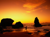 Runner Silhouetted on Beach