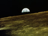 Earth Rise Over Moon Surface