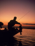 Silhouette of Bass Fisher at Sunset