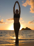 Woman Stretching on Beach